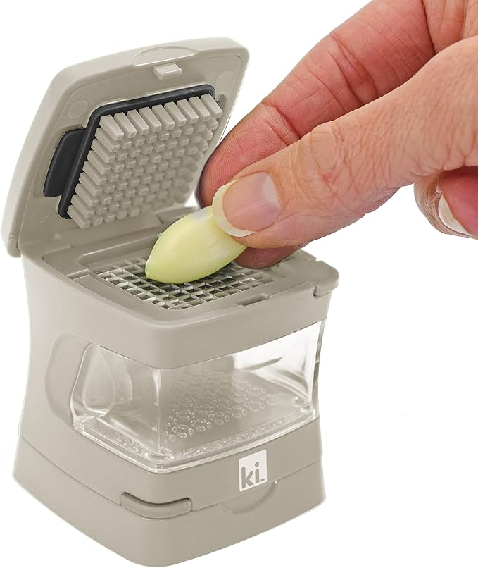 Kitchen Innovations Garlic-A-Peel Garlic Press, Crusher, Cutter, Mincer, and Storage Container - Includes Silicone Garlic Peeler - Easy to Clean - Stainless Steel Blades – (Cream), standard