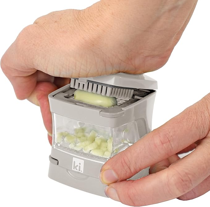 Kitchen Innovations Garlic-A-Peel Garlic Press, Crusher, Cutter, Mincer, and Storage Container - Includes Silicone Garlic Peeler - Easy to Clean - Stainless Steel Blades – (Cream), standard
